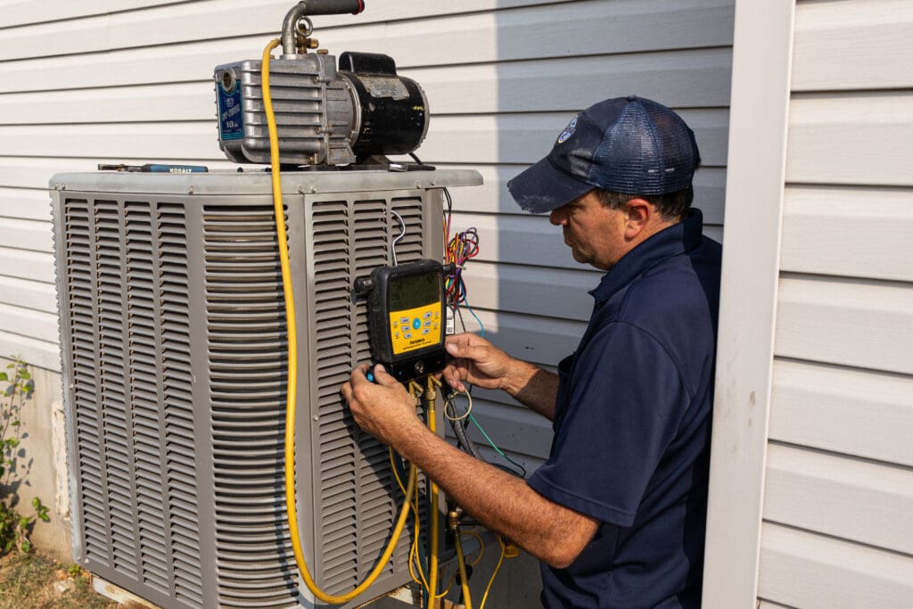 HVAC Technician performing Maintenance